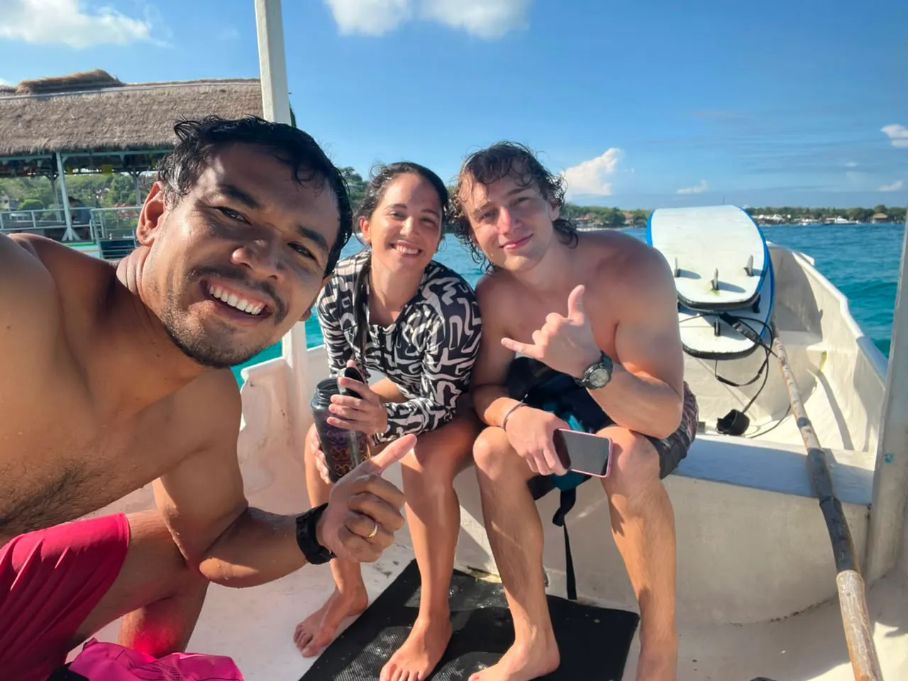 Loxy on the boat with two stoked students after a surf session at Nusa Lembongan