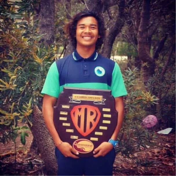 A young Loxy holding the MR Shield open boys surfing trophy